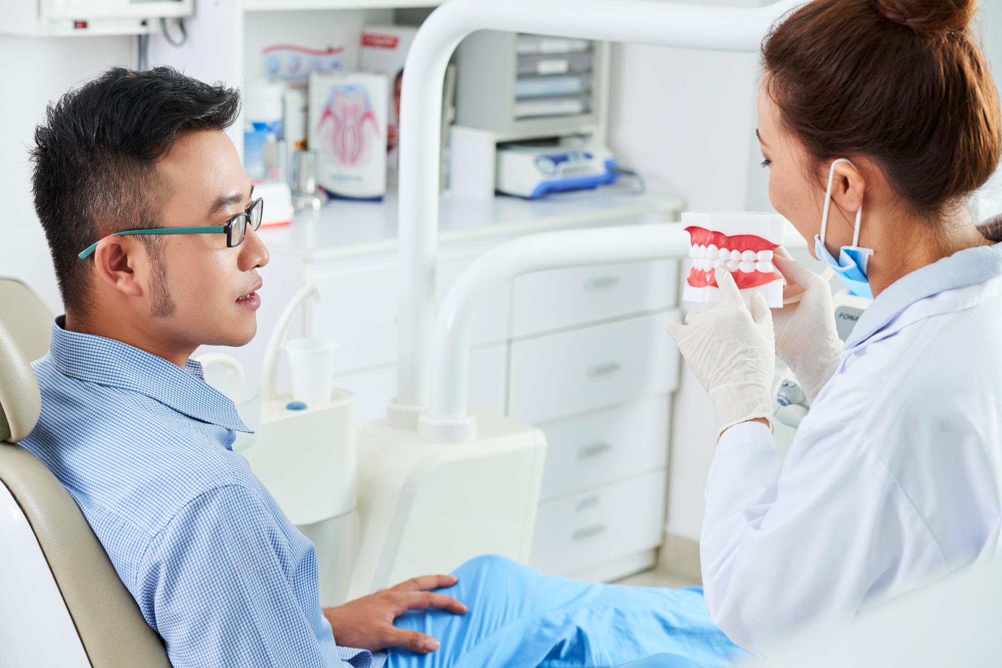 Orthodontist Explaining Something To Patient