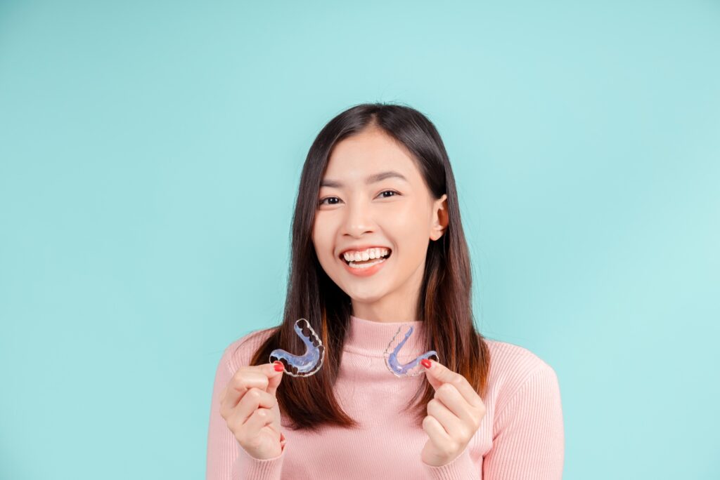 Dental Beautiful smiling of young asian woman with retainer braces