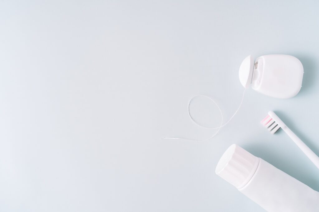 Dental hygiene supplies on a blue background