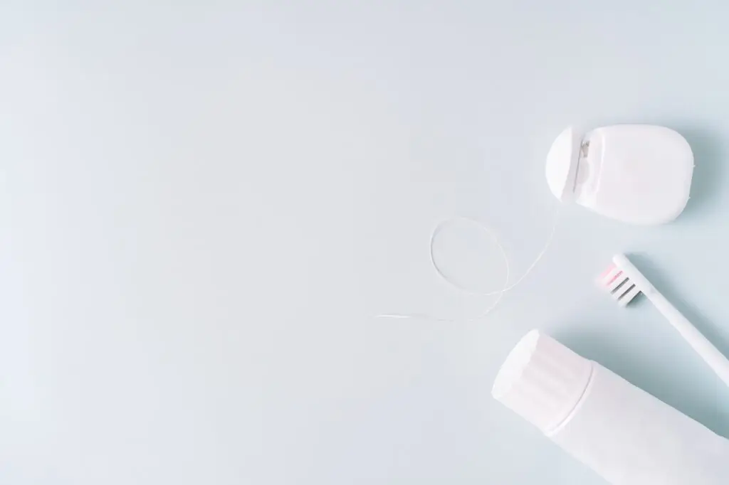 Dental hygiene supplies on a blue background